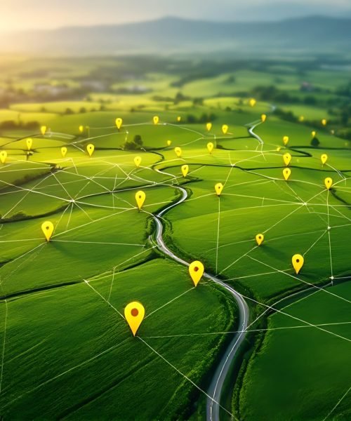 Aerial view of land with network markers representing land development planning and connectivity.